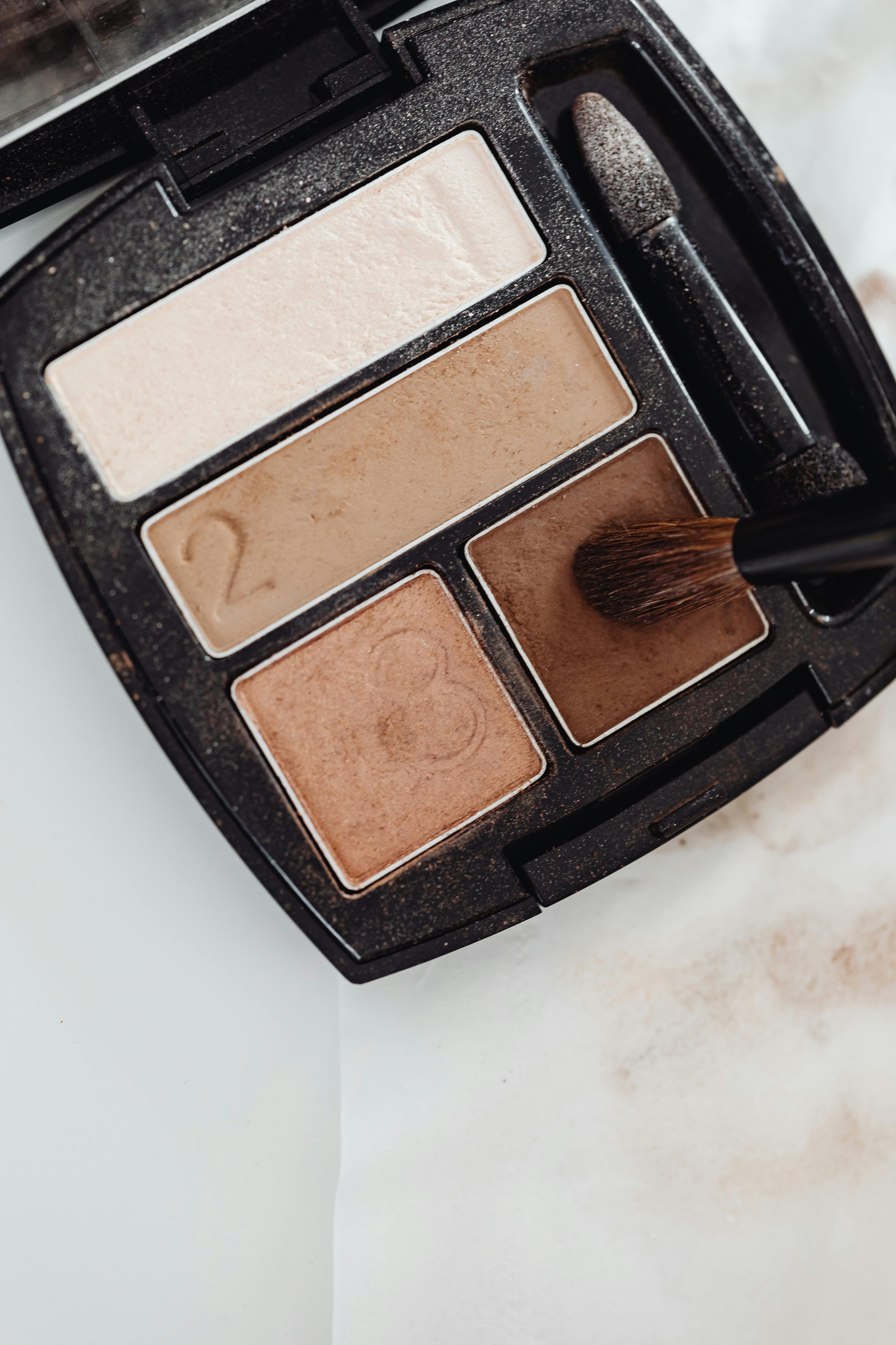 Open eyeshadow palette with neutral shades